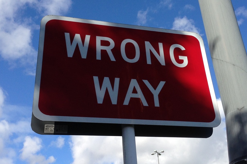 Stock photo of a sign that reads "Wrong Way".